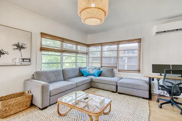 Spacious lounge combines sectional comfort with a convenient work area