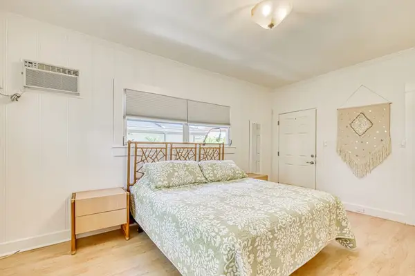 Peaceful king bedroom with light décor and comfortable sleeping space