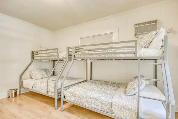 Second bedroom includes sturdy bunk beds for flexible group sleeping