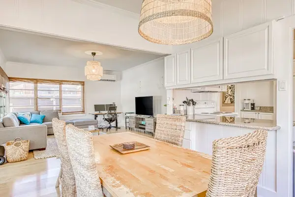 Enjoy casual meals in the airy dining room beside bright windows