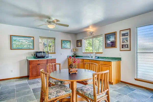 Wooden Table & Chairs, Kitchen Counters, Ceiling Fan & Bright Windows