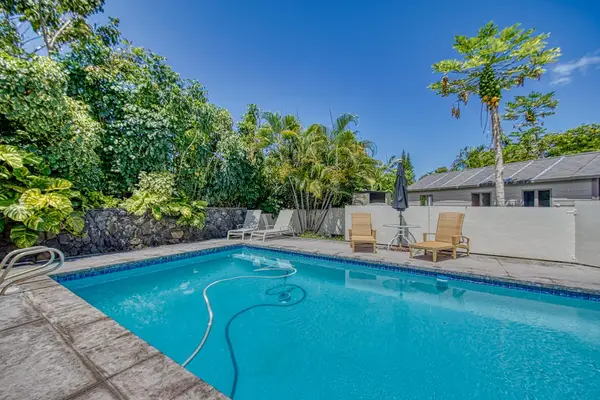 Private In-Ground Swimming Pool, Poolside Lounge Chairs & Tropical Landscaping
