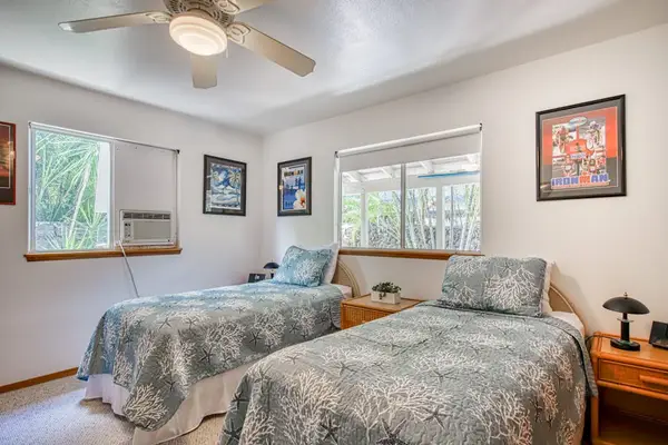 Two Full Beds, Ceiling Fan, Nightstand with Lamp, Bright Windows & Wall Art