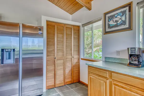 Stainless Steel Refrigerator, Spacious Cabinetry, Counter Prep Space & Pantry Closet