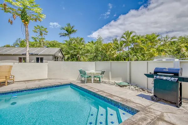 Swimming Pool Steps, Outdoor BBQ Grill, Patio Seating & Private Fence