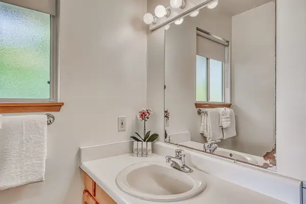 Vanity Sink, Large Mirror, Bright Vanity Lighting, Hand Towel Rack & Natural Light