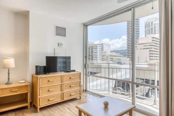 Settle in for a relaxing break with a TV, center table, and beautiful surroundings.
