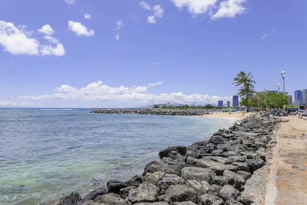 Enjoy the soothing rhythm of waves meeting the sand.