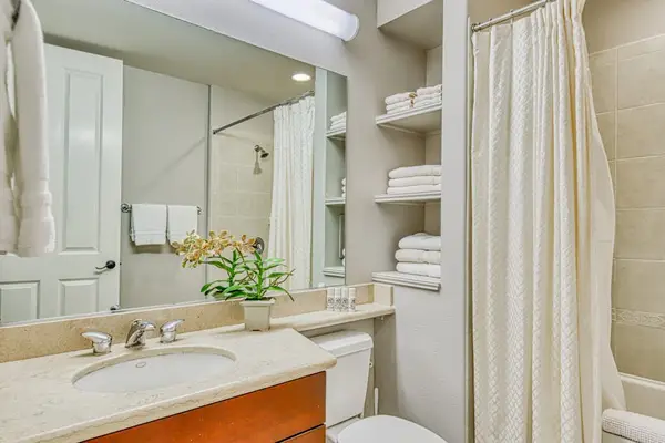 Full bathroom with ample storage