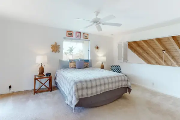 Offers restful sleeping beneath a sloped island-style ceiling