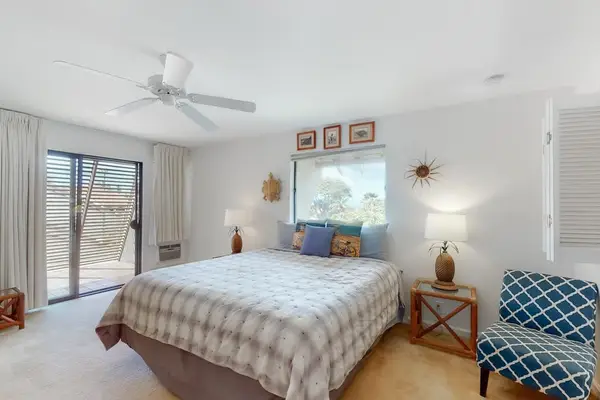 Cozy bedroom with inviting bedding and a peaceful resort atmosphere