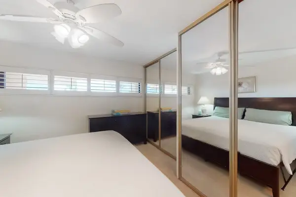 Spacious Bedroom With Mirrored Closets