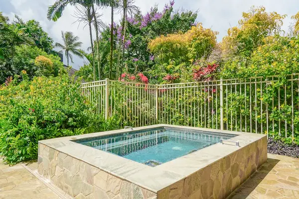 Relax poolside and enjoy the peaceful tropical setting.