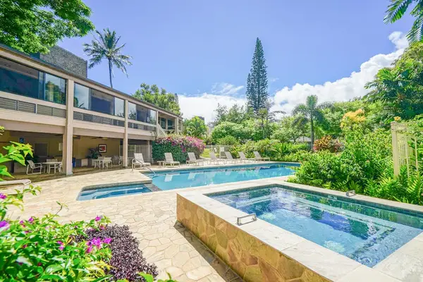 Unwind in the relaxing hot tub surrounded by tropical gardens.