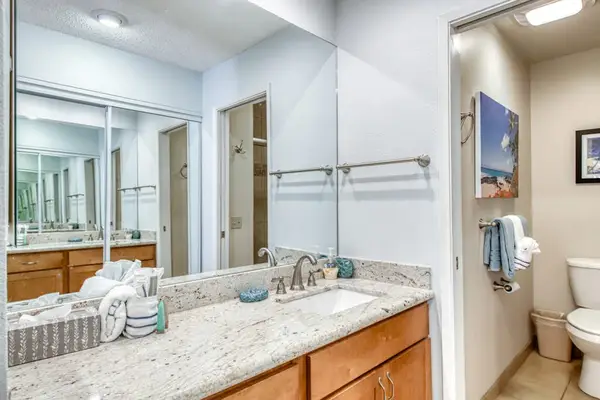 Full Bathroom shower and vanity pair clean tile with storage