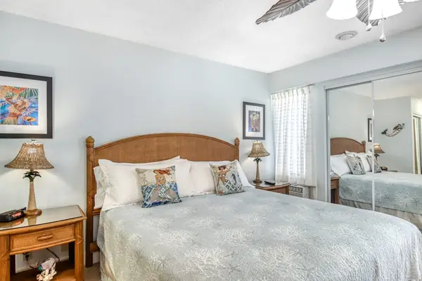 Offers restful bedding beneath white ceilings and daylight
