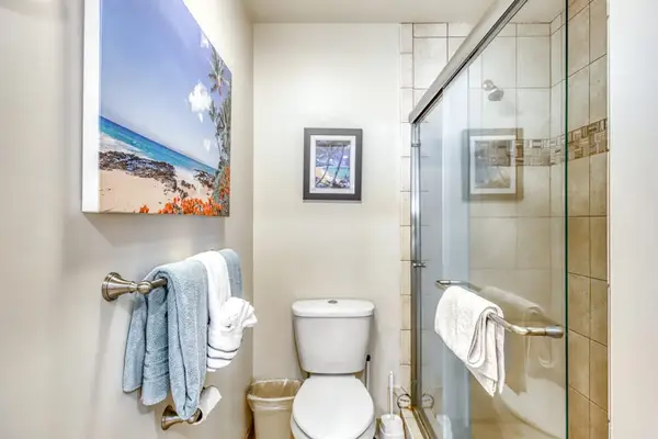 Full Bathroom showcases glass shower bright vanity and white finishes