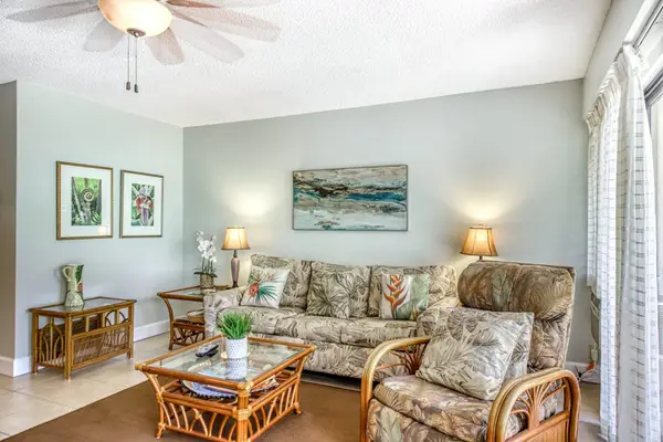 Living room seating invites relaxed conversations beneath ceiling fans daily