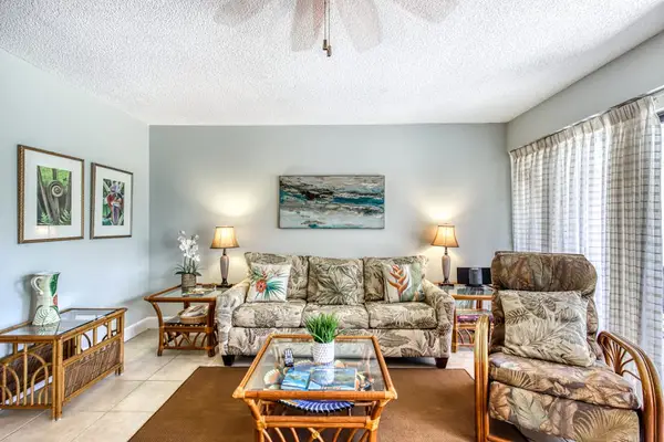 Inviting living room features generous seating and easy outdoor access