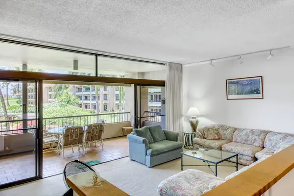 Bright living room with lanai access