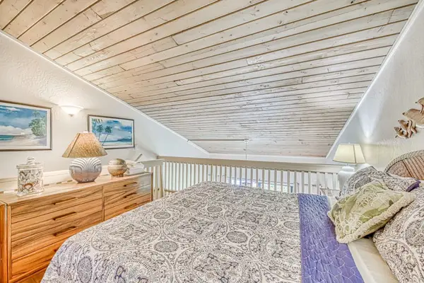 Comfortable loft bedroom with tropical charm