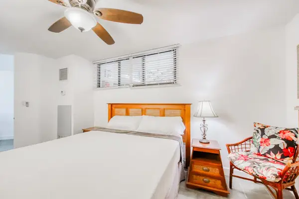 Bright king bedroom with a cozy tropical ambiance
