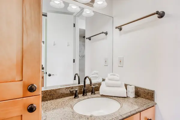 Bright bathroom vanity with granite countertops