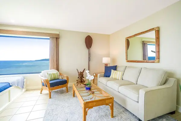 Living room lounge area with direct views of the Pacific Ocean