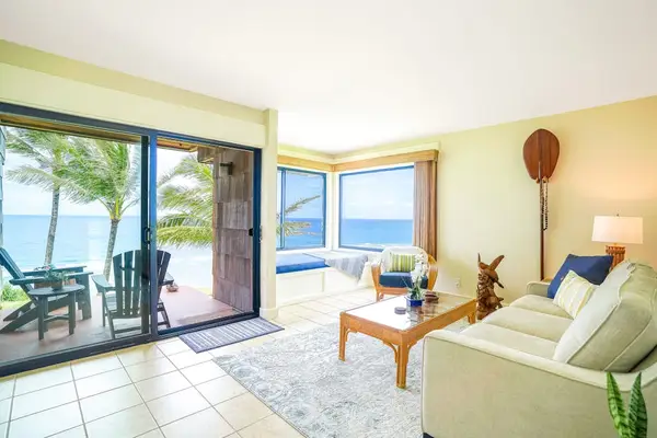 Bright living area with ocean views and access to the private lanai