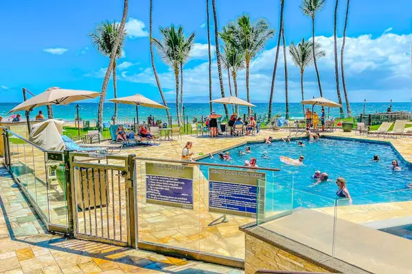 Relax poolside surrounded by tropical landscaping