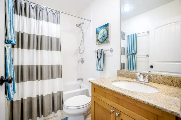 Guest bathroom with tub/shower combo.
