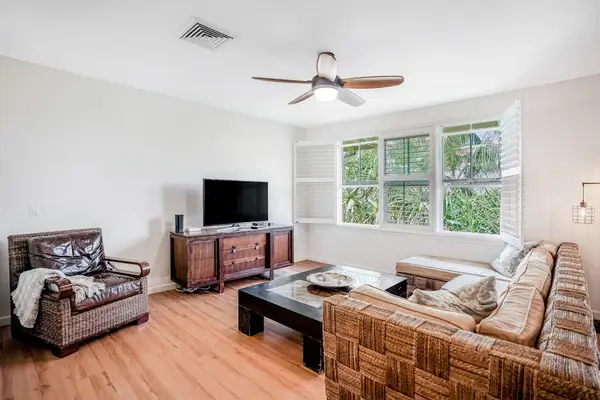 The living room is light-filled and boasts comfortable furniture (large sectional sofa and armchair) near a flatscreen Smart TV with cable. You're all set for movie nights with the family!