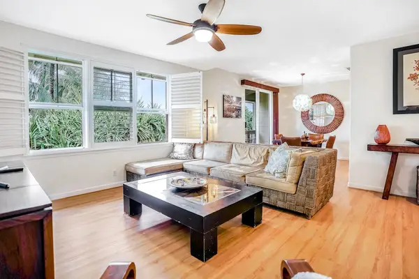 The living room is light-filled and boasts comfortable furniture (large sectional sofa and armchair) near a flatscreen Smart TV with cable. You're all set for movie nights with the family!