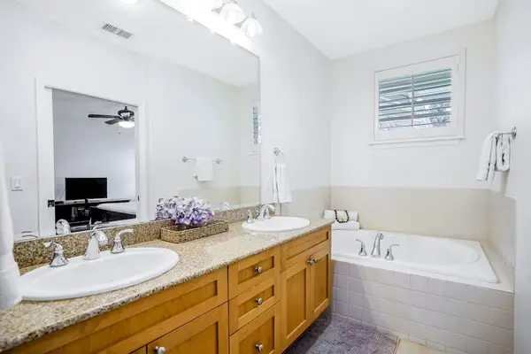 Master bathroom with double sinks, garden tub and walk in shower.
