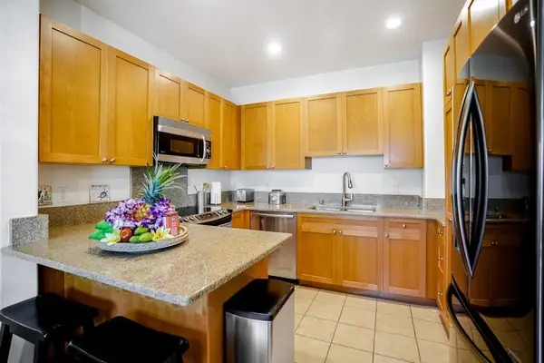 Fully-equipped kitchen, which is complete with all the modern appliances to make cooking a breeze, including a French-door fridge, stove, oven, dishwasher, microwave, and coffee maker.