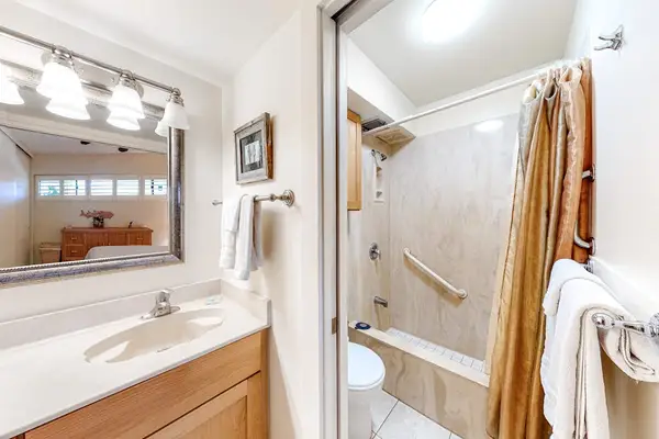 Bright En-Suite Bathroom Stocked With Fresh Amenities