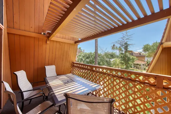Balcony dining space overlooking tropical surroundings for memorable meals and relaxing moments together