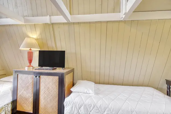 Spacious studio combines sleeping area and TV for effortless comfort throughout your stay