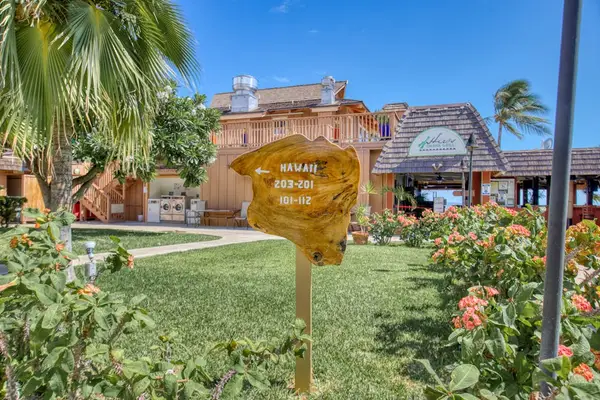 Tropical resort setting featuring beautifully maintained grounds and inviting open-air spaces throughout