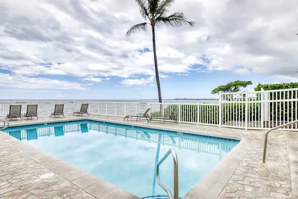 Oceanfront Swimming Pool Deck with Lounge Chairs & Tropical Views