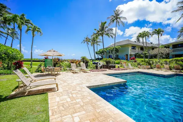 Resort pool with lounge chairs for sunny afternoons