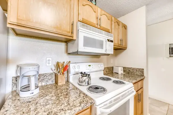 Kitchen area provides appliances countertops and convenient meal preparation space