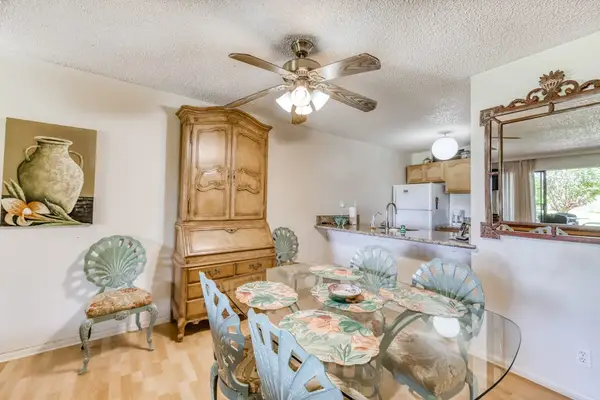 Bright dining area combines comfortable seating artwork and natural light