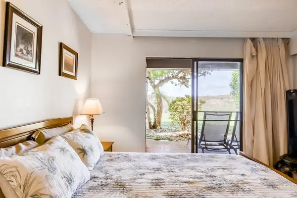 Bedroom seating area provides relaxing views across tropical resort grounds