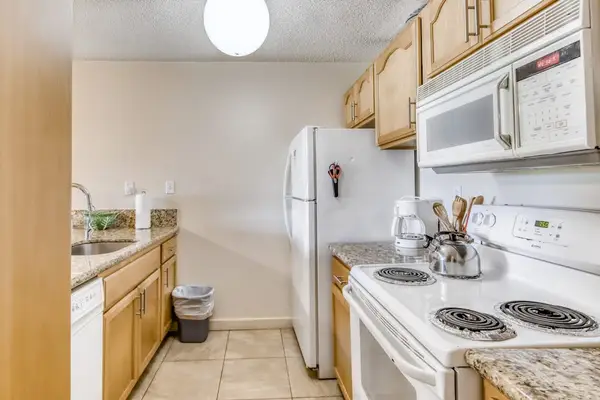Bright living area connects comfortable seating with the kitchen space
