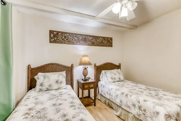 Two comfortable single beds provide restful sleep for friends family or travel companions
