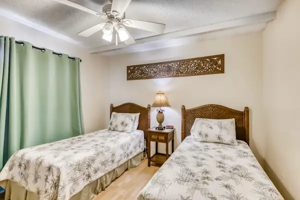 Two single beds offer a comfortable space for restful nights and refreshing mornings