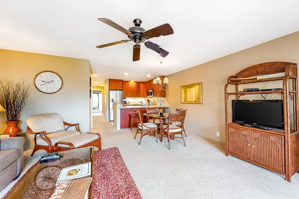 Inviting living room pairs island comfort with breezy lanai access