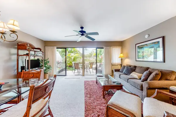 Open living room welcomes guests with light and lanai views