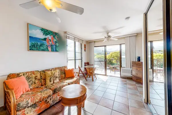 Cozy studio with a comfortable sofa, offering a welcoming space to relax and unwind